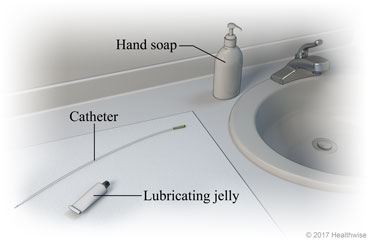 Bathroom sink area, showing hand soap, catheter, lubricating jelly, and mirror on clean cloth