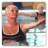 Photo of a woman doing aerobic exercise in a swimming pool